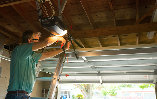 MN Garage Squad performing expert winter garage door repairs to ensure optimal function despite cold weather challenges