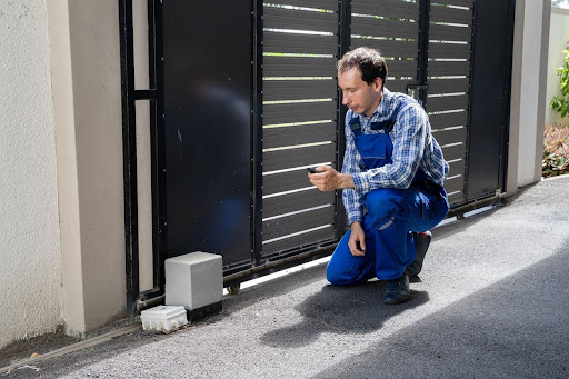 Adjusting garage door tracks to prevent alignment issues and ensure smooth operation, performed by MN Garage Squad